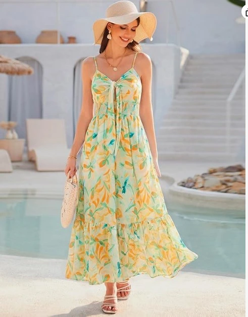 Women's floral maxi dress with spaghetti straps and straw hat for summer