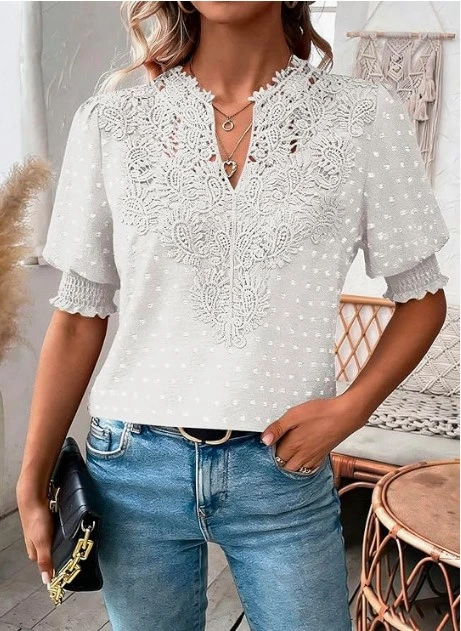 Women's white lace detail puff sleeve blouse with blue jeans