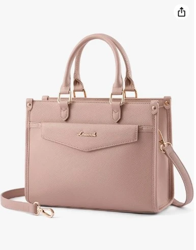 ini Structured Handbag with Crossbody Strap Some bags just make you feel soft and put-together at the same time. This dusty blush pink satchel is exactly that. The structured silhouette with clean lines, gold-tone hardware, and a front envelope pocket gives it a polished, grown-up look that still feels feminine. It's compact enough to feel light on your shoulder, but roomy enough for your essentials — phone, wallet, keys, lip gloss, and a little confidence. Wear it cross-body or hand-carry. Either way, compliments are coming. Why you'll love it Pink bags are having a major moment — and this shade of blush works with literally everything. Neutrals, white, earth tones, even a classic black outfit. It's the bag that makes everything you already own look more intentional.