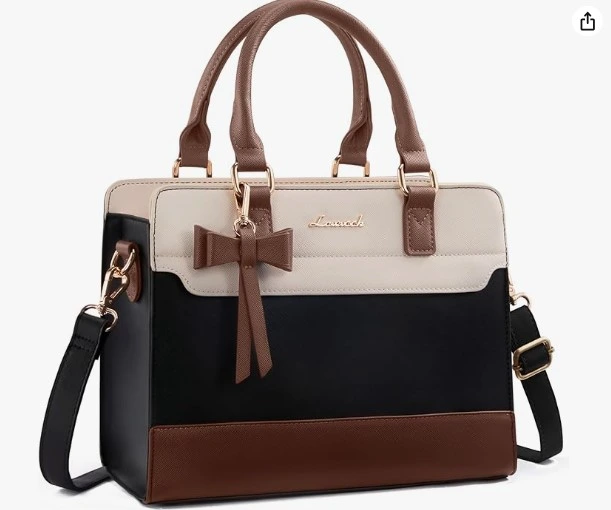 Structured Top-Handle Bag in Black, Cream & Brown Meet the most editorial bag in this roundup. The tri-tone design — cream top panel, deep black middle, and warm brown bottom with matching handles — is bold, structured, and completely unforgettable. The gold bow charm at the center adds a playful feminine touch to what would otherwise be a very classic silhouette. The gold hardware throughout ties all three tones together perfectly. This is a bag for women who love a little drama in their accessories. Why you'll love it Color-blocking is everywhere this season, and this bag does it with elegance. The cream-black-brown combination works as both a neutral and a statement piece — it stands out without clashing with anything you already own.